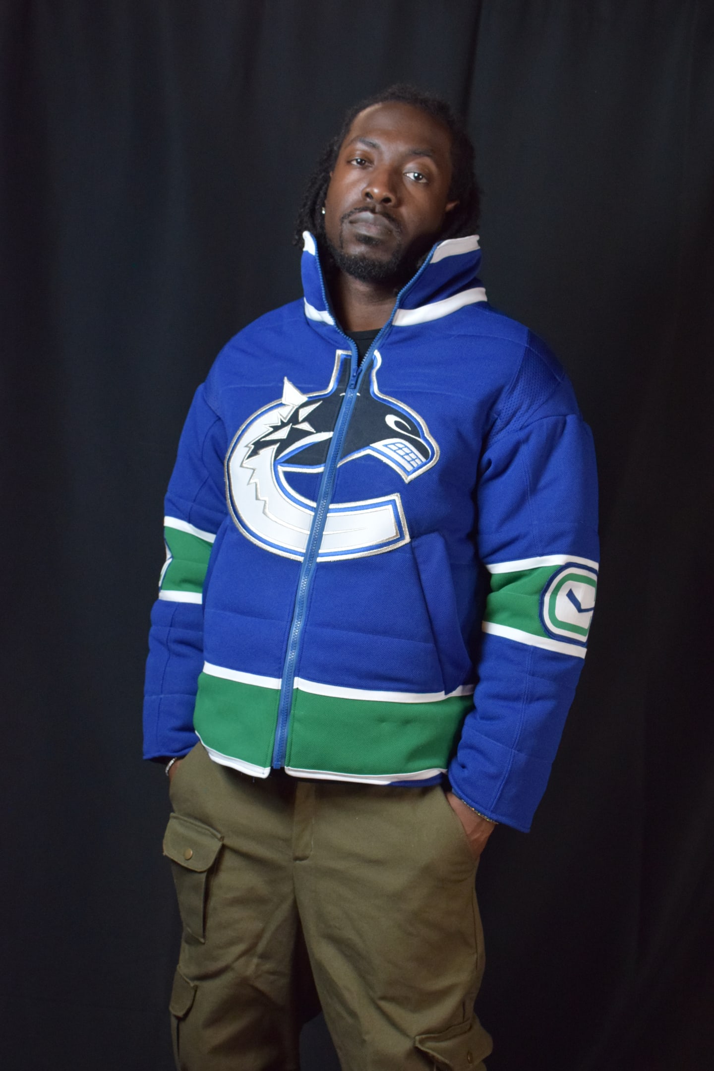 Custom TMADE puffer jacket built from a Vancouver Canucks jersey