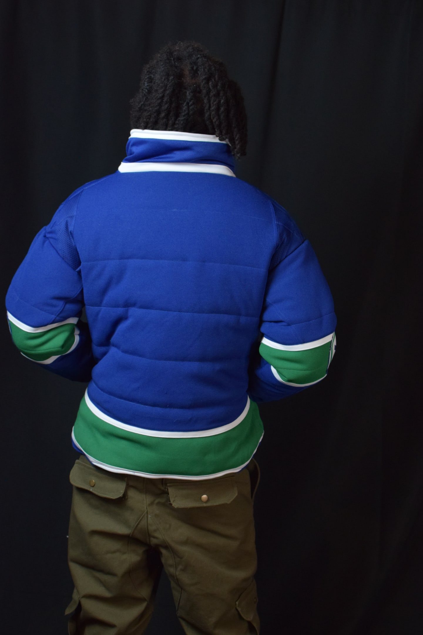 Custom TMADE puffer jacket built from a Vancouver Canucks jersey