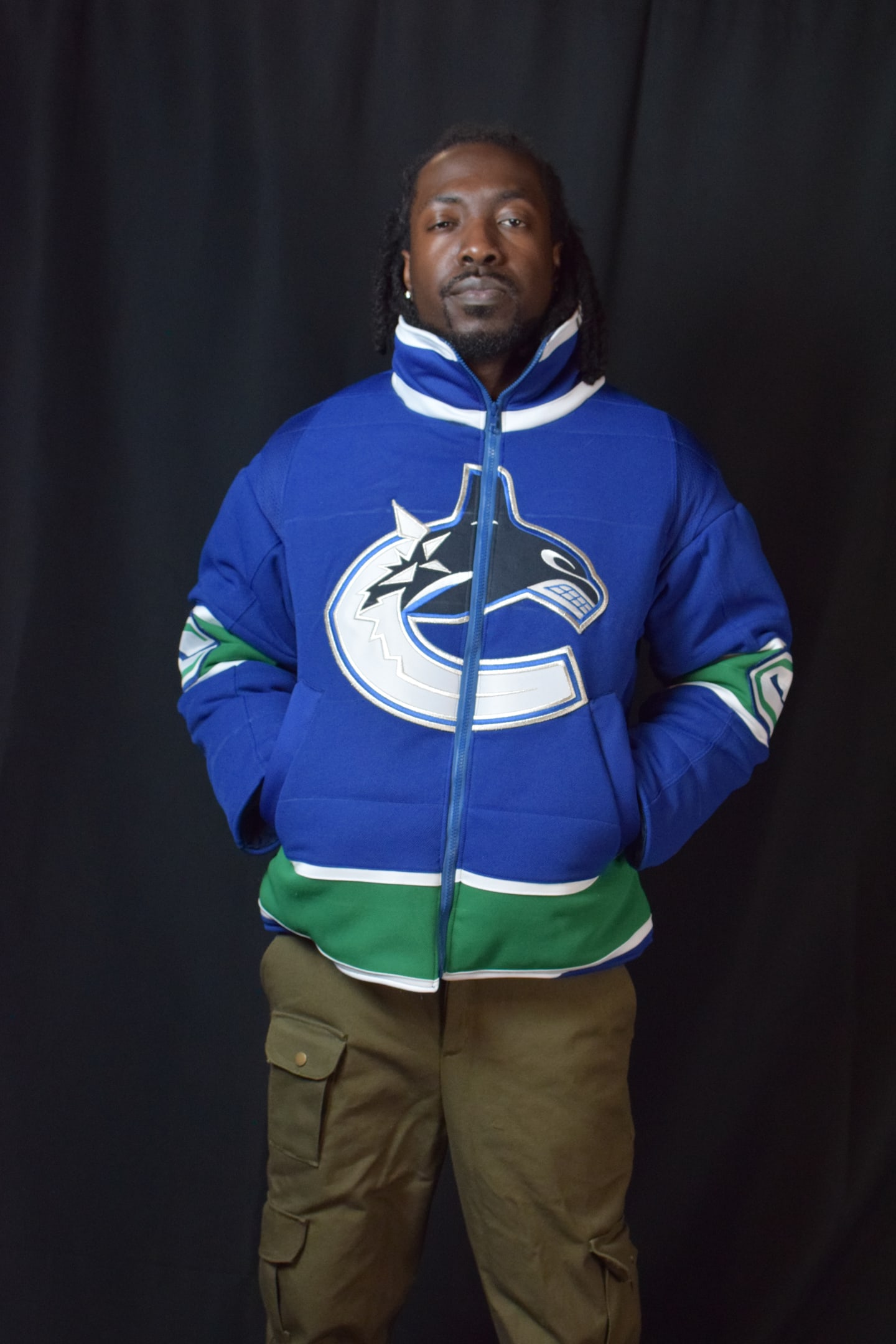 Custom TMADE puffer jacket built from a Vancouver Canucks jersey