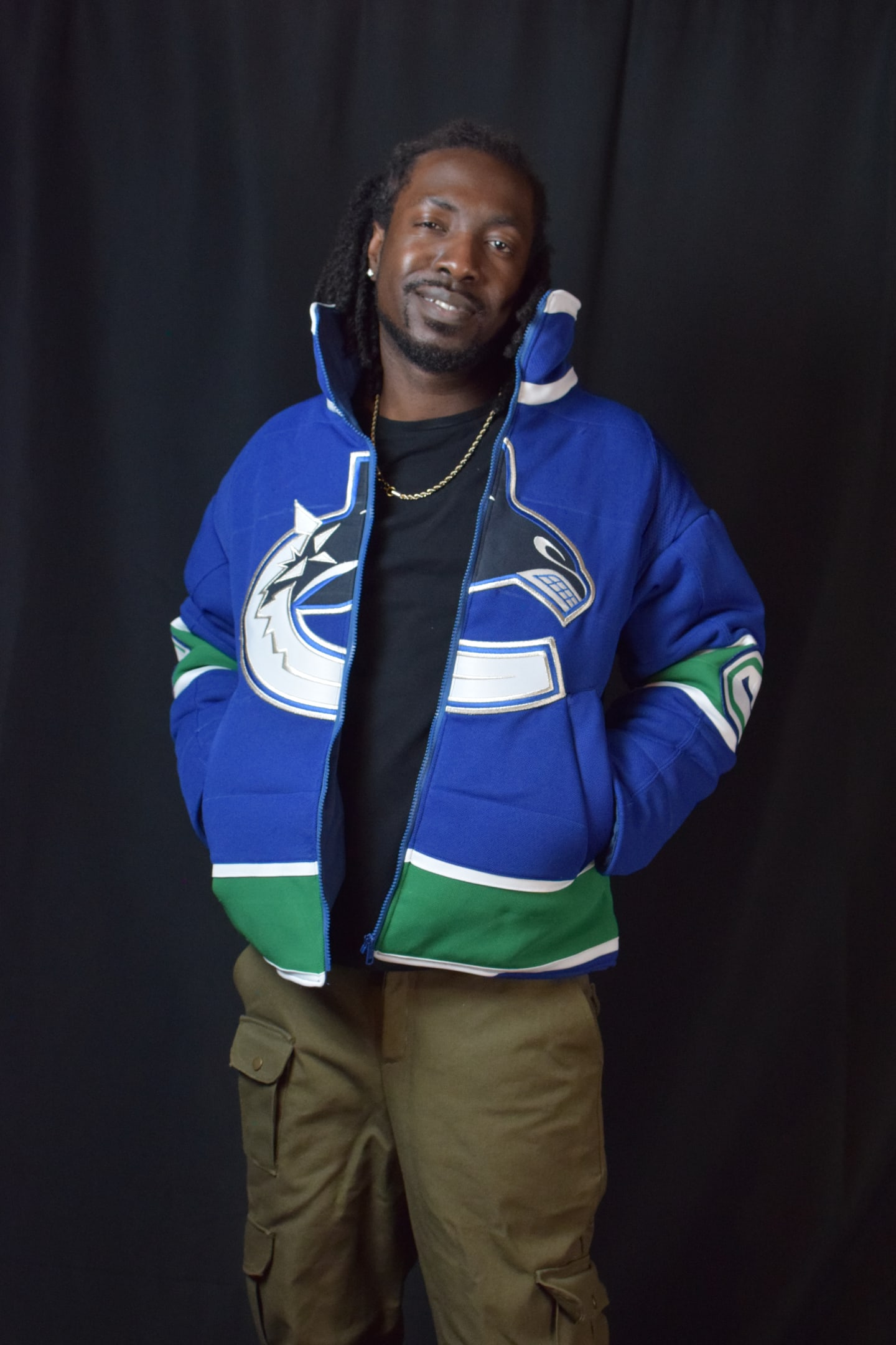 Custom TMADE puffer jacket built from a Vancouver Canucks jersey