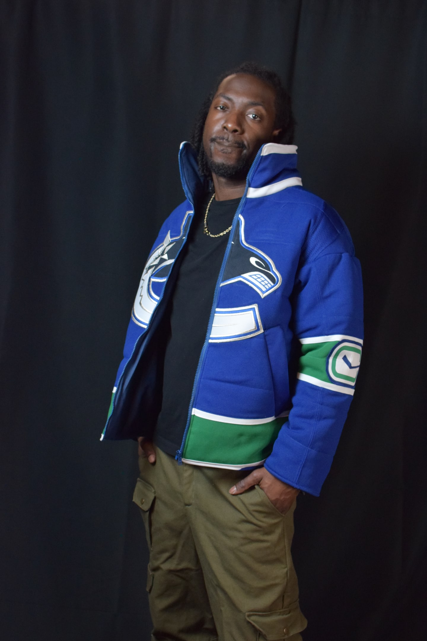 Custom TMADE puffer jacket built from a Vancouver Canucks jersey