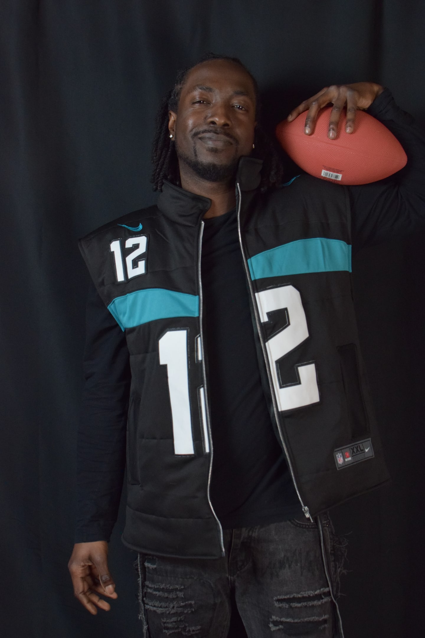 Custom TMADE puffer vest built from a Jacksonville Jaguars Hunter number 12 jersey