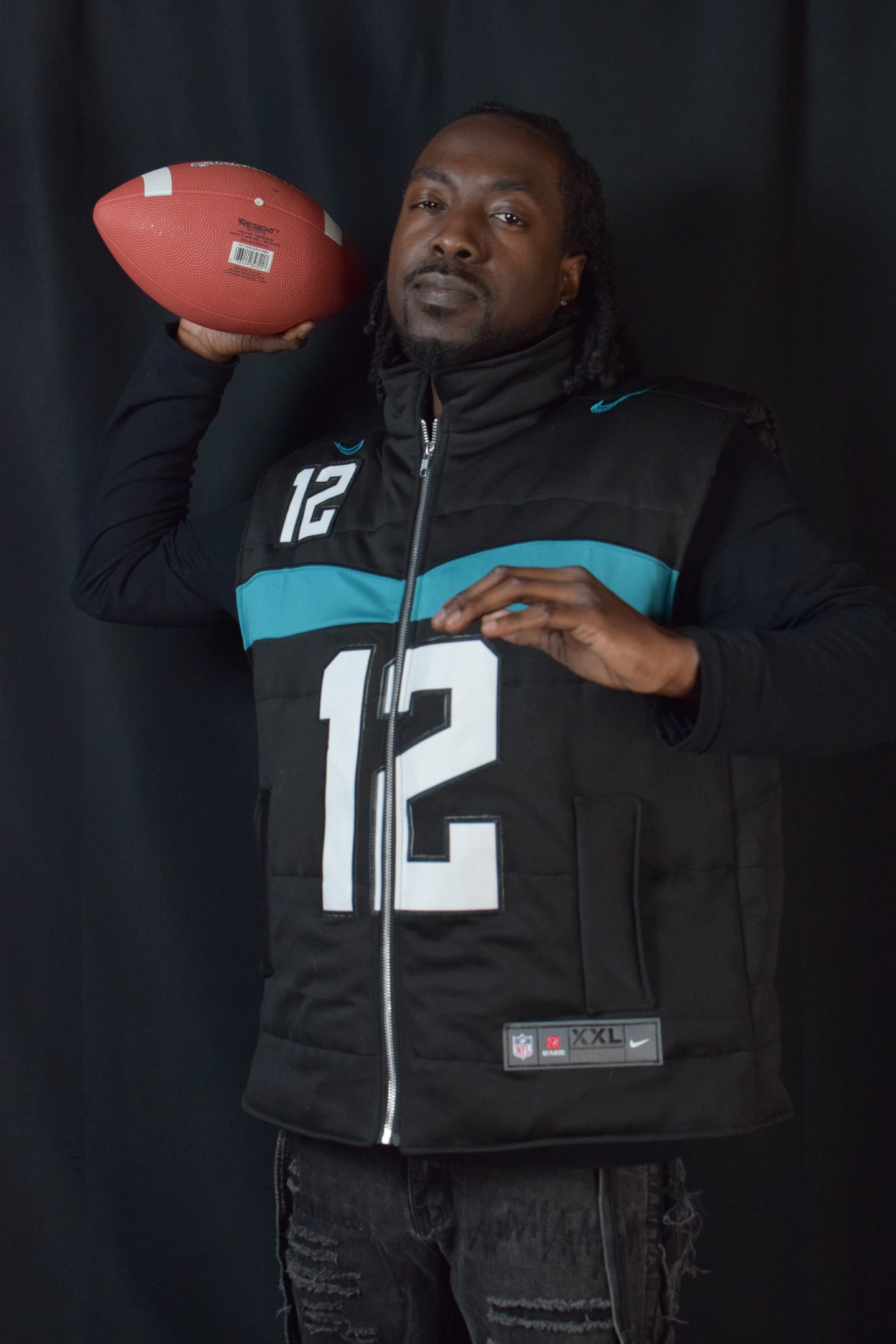 Custom TMADE puffer vest built from a Jacksonville Jaguars Hunter number 12 jersey