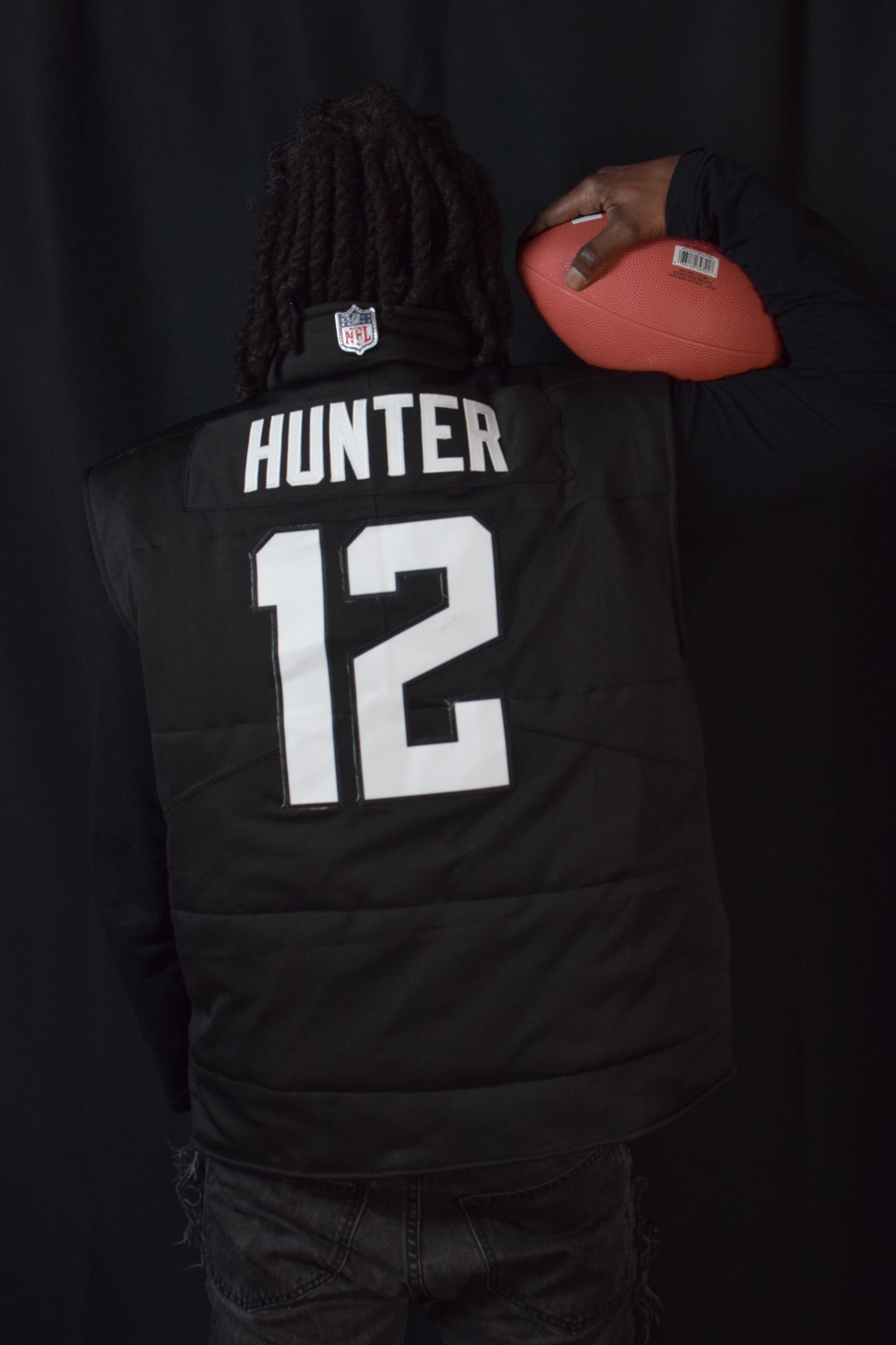 Custom TMADE puffer vest built from a Jacksonville Jaguars Hunter number 12 jersey