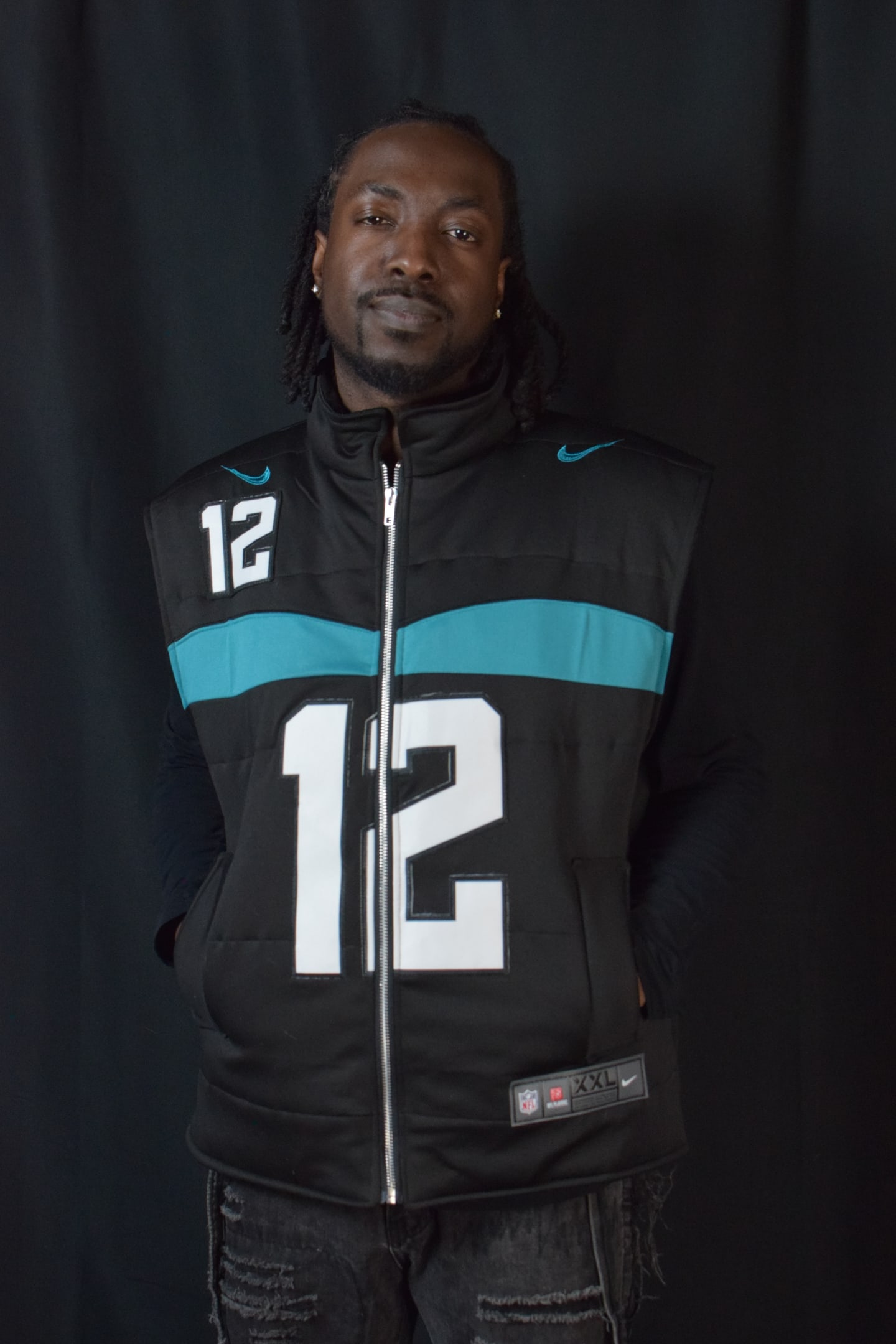 Custom TMADE puffer vest built from a Jacksonville Jaguars Hunter number 12 jersey