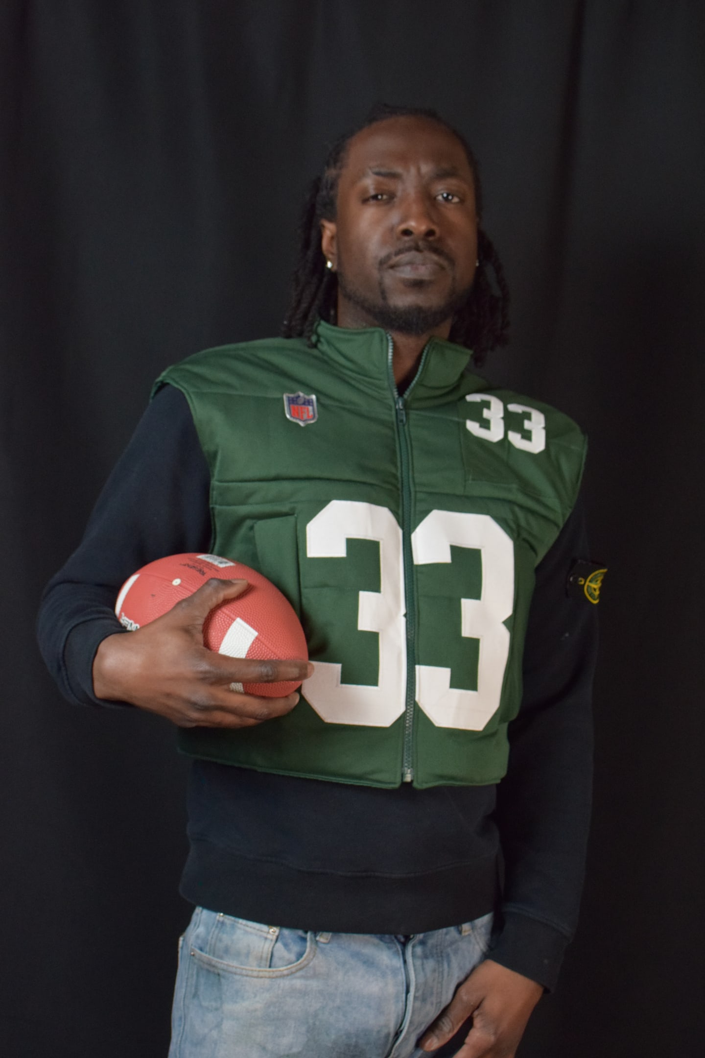 Custom TMADE puffer vest built from a Green Bay Packers Jones number 33 jersey