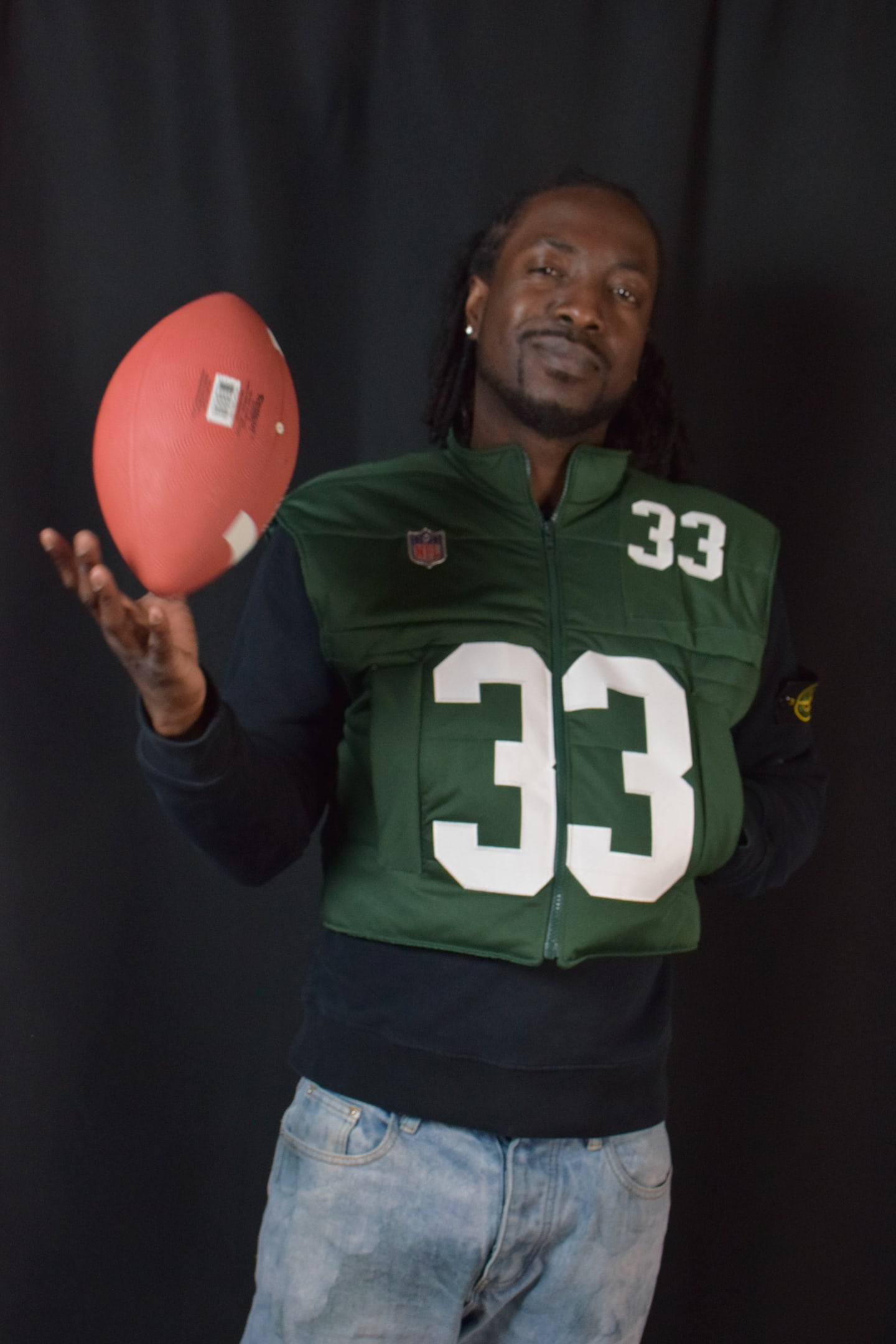 Custom TMADE puffer vest built from a Green Bay Packers Jones number 33 jersey