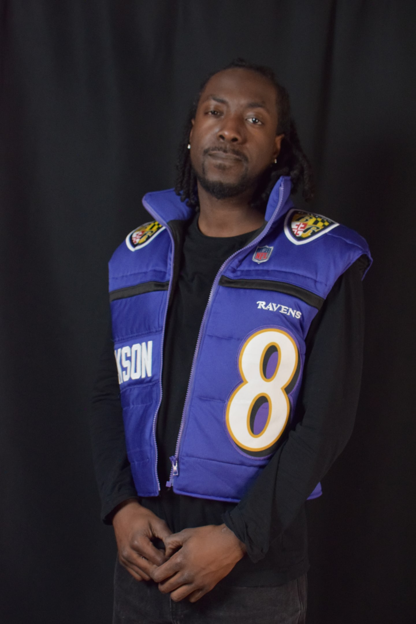 Custom TMADE puffer vest built from a Baltimore Ravens Jackson number 8 jersey