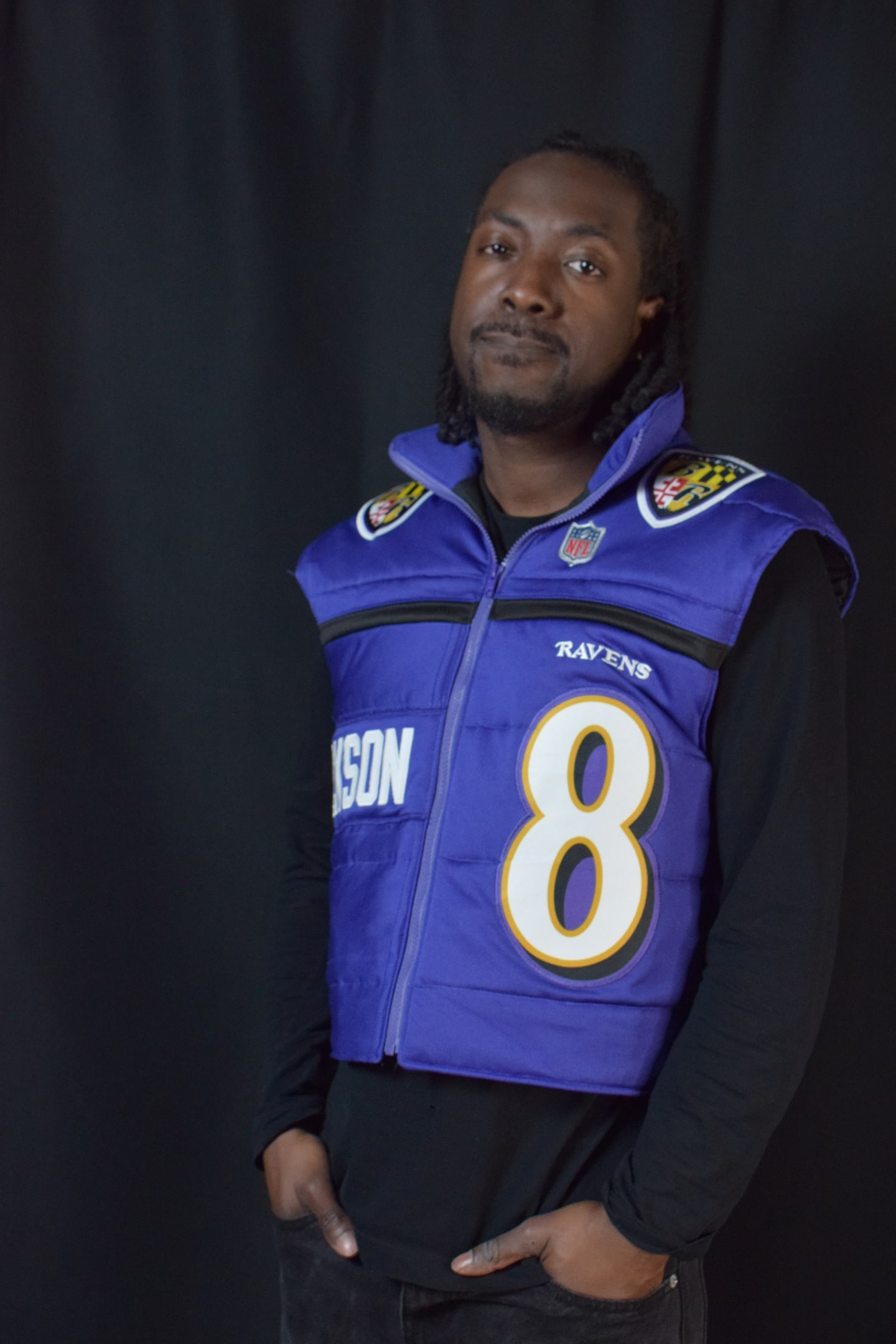 Custom TMADE puffer vest built from a Baltimore Ravens Jackson number 8 jersey