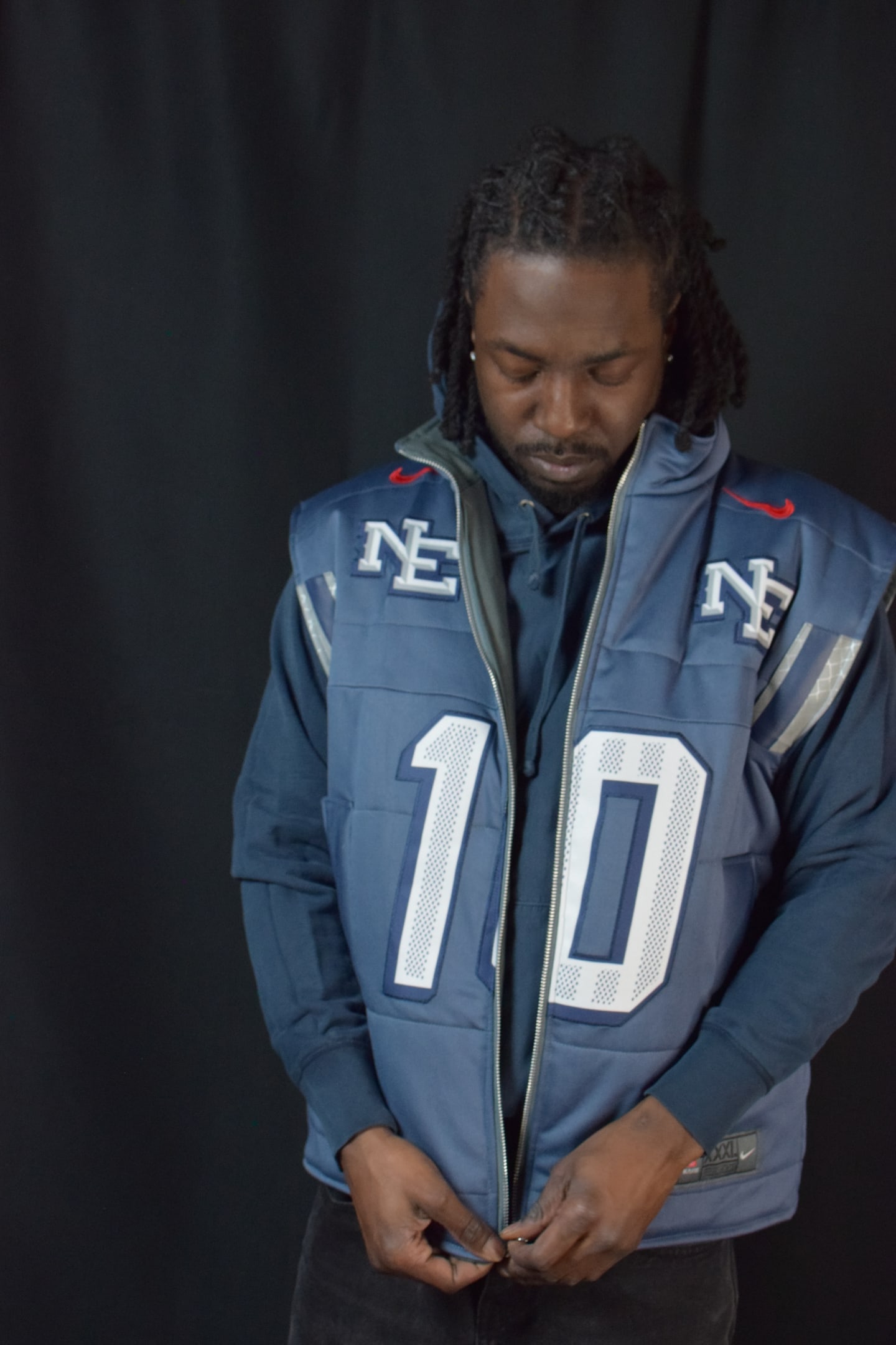 Custom TMADE puffer vest built from a New England Patriots Maye number 10 jersey