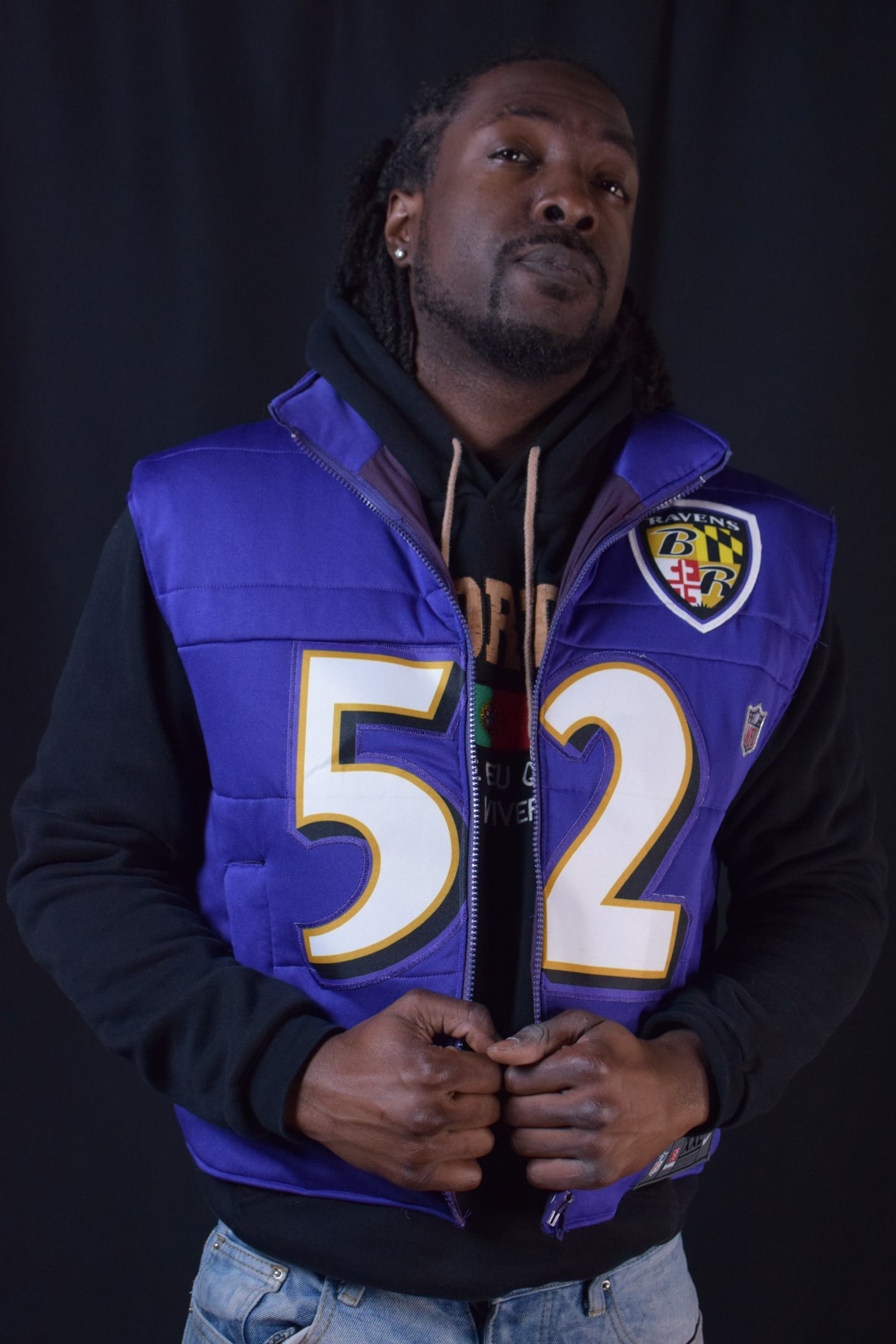 Custom TMADE puffer vest built from a Baltimore Ravens R. Lewis number 52 jersey