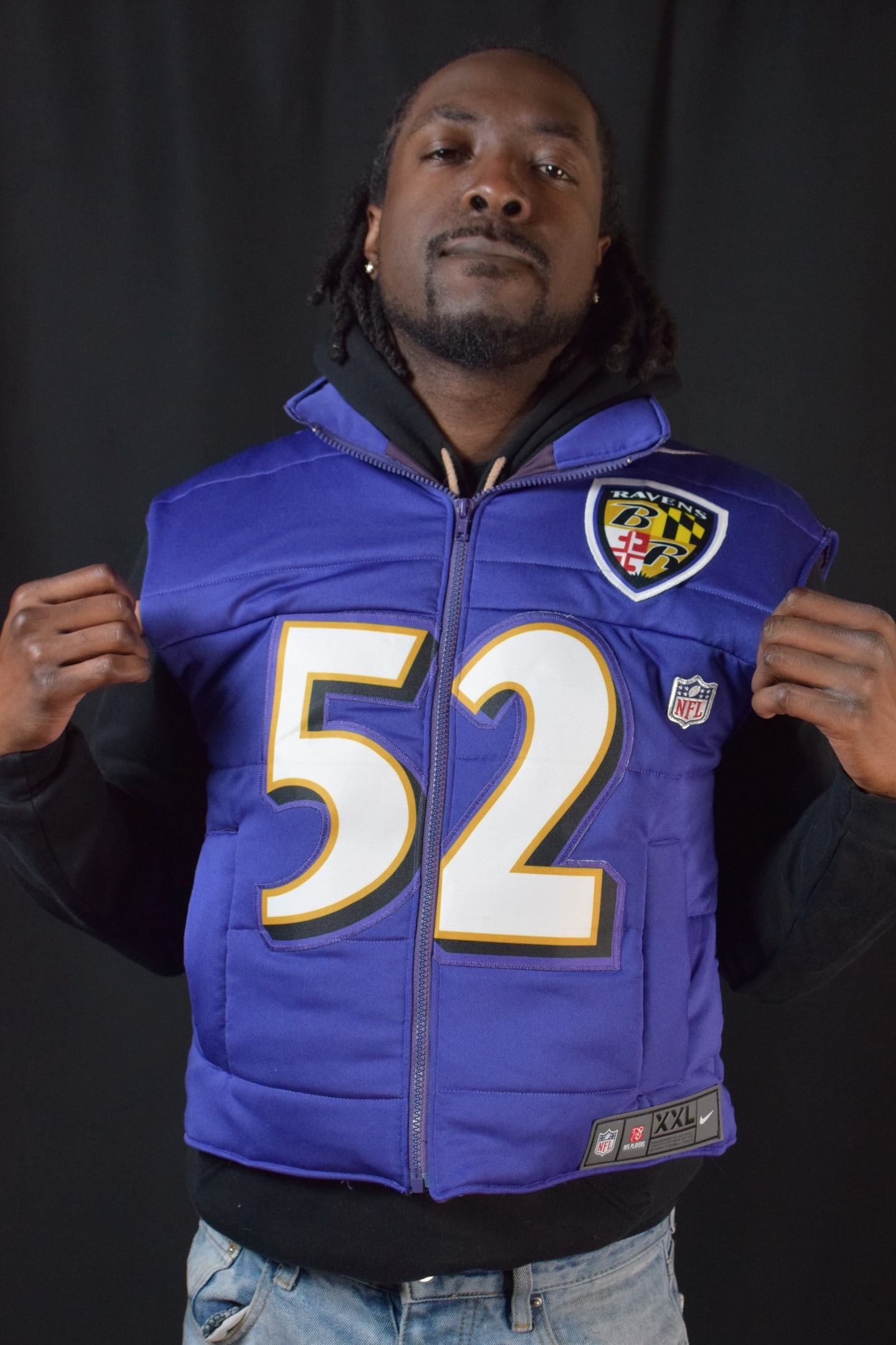 Custom TMADE puffer vest built from a Baltimore Ravens R. Lewis number 52 jersey