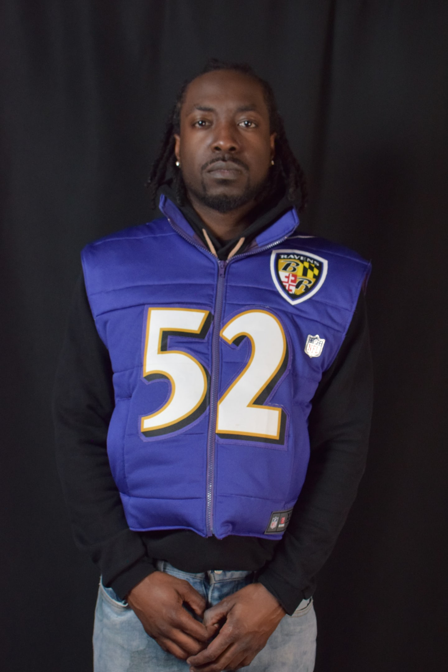 Custom TMADE puffer vest built from a Baltimore Ravens R. Lewis number 52 jersey