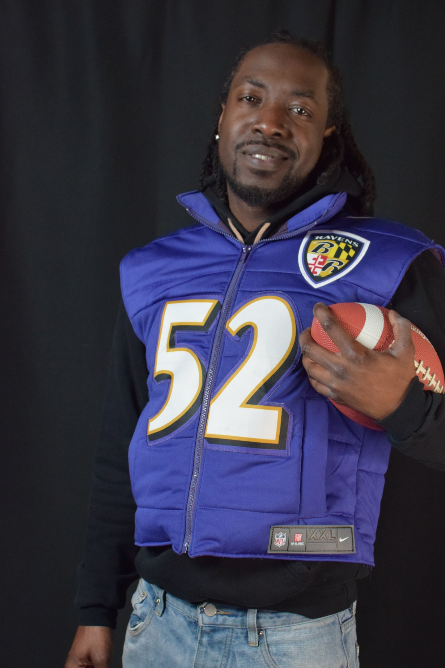 Custom TMADE puffer vest built from a Baltimore Ravens R. Lewis number 52 jersey