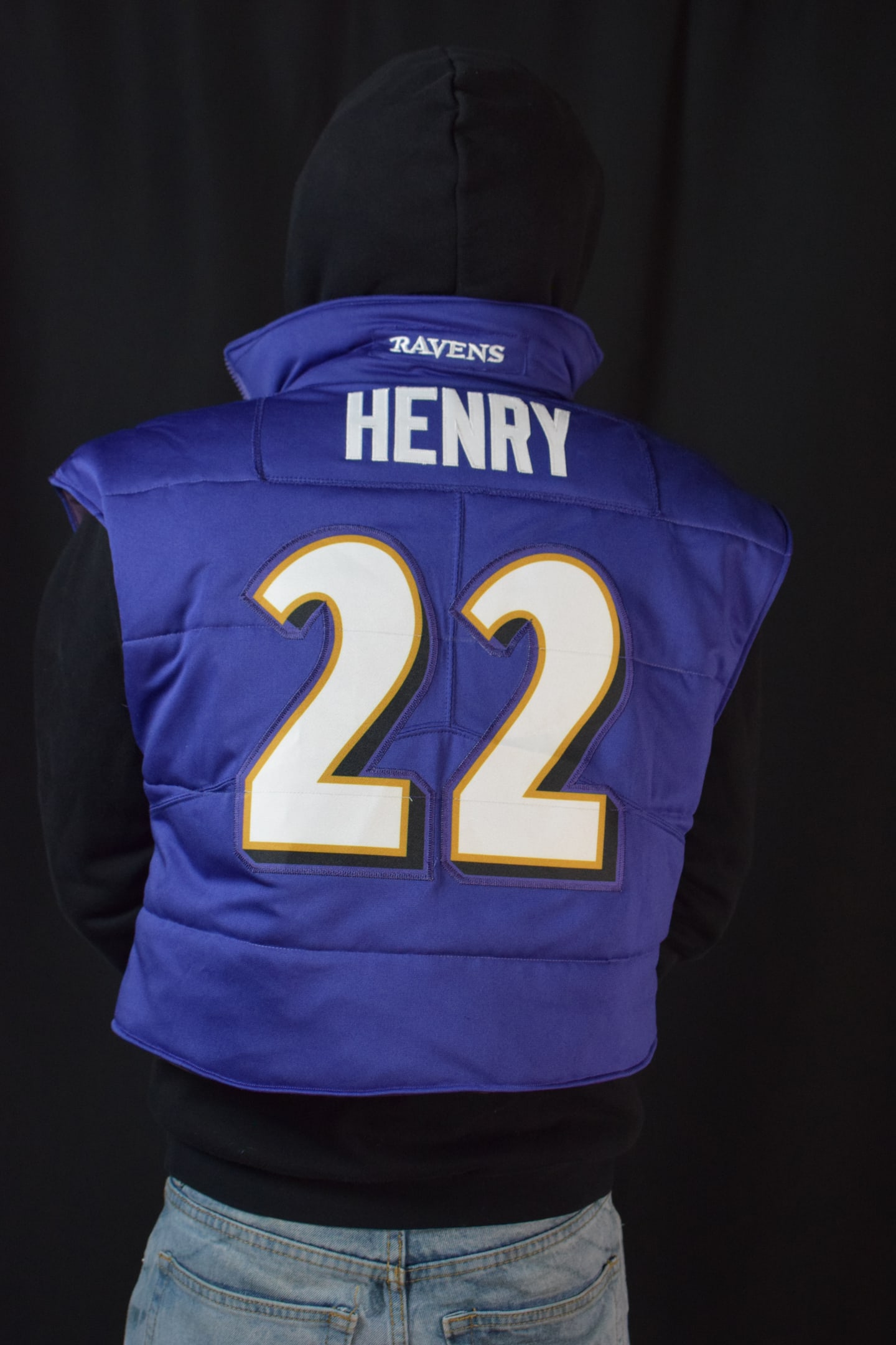 Custom TMADE puffer vest built from a Baltimore Ravens Henry number 22 jersey