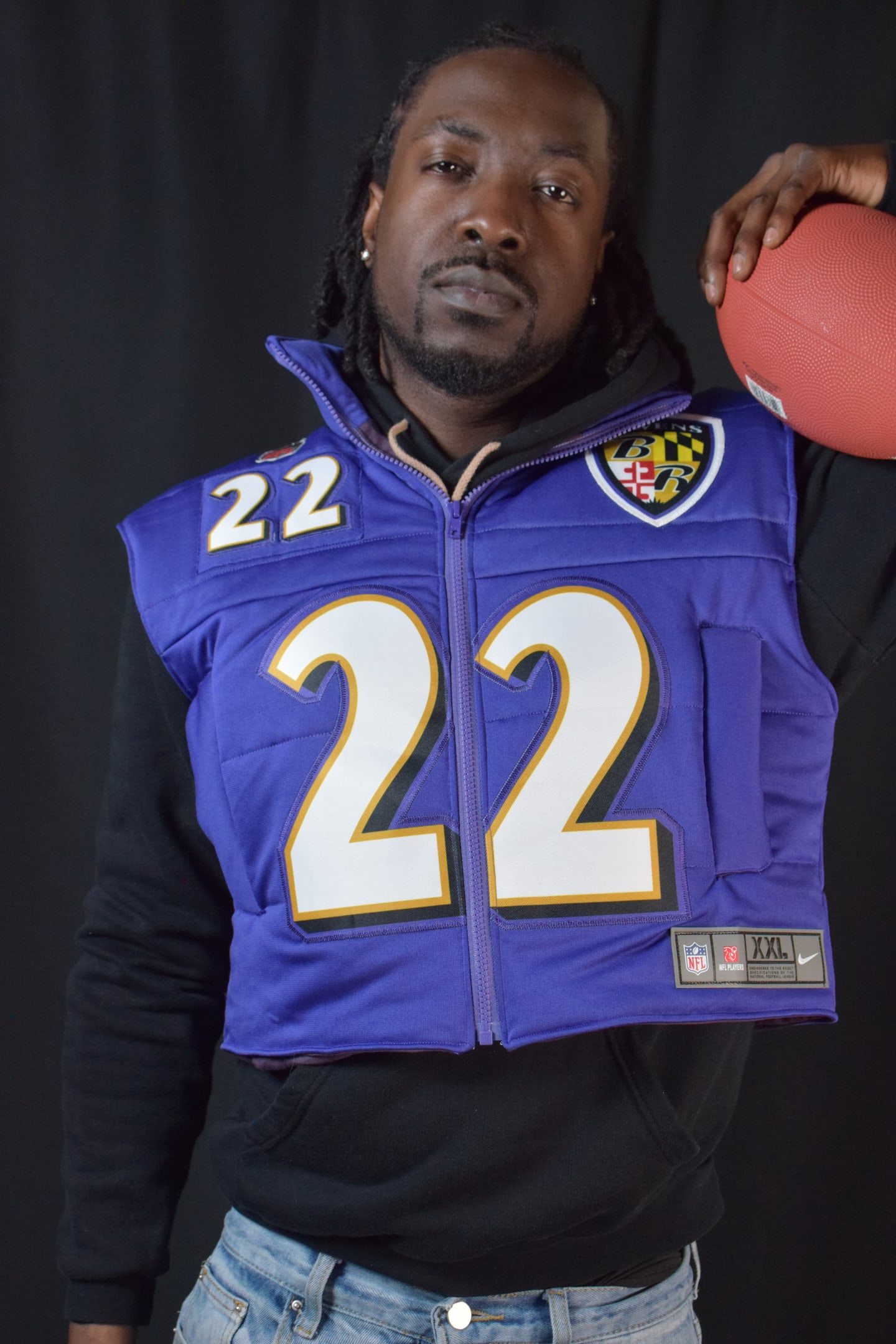 Custom TMADE puffer vest built from a Baltimore Ravens Henry number 22 jersey