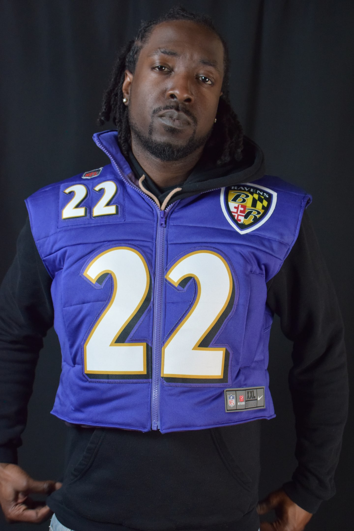 Custom TMADE puffer vest built from a Baltimore Ravens Henry number 22 jersey