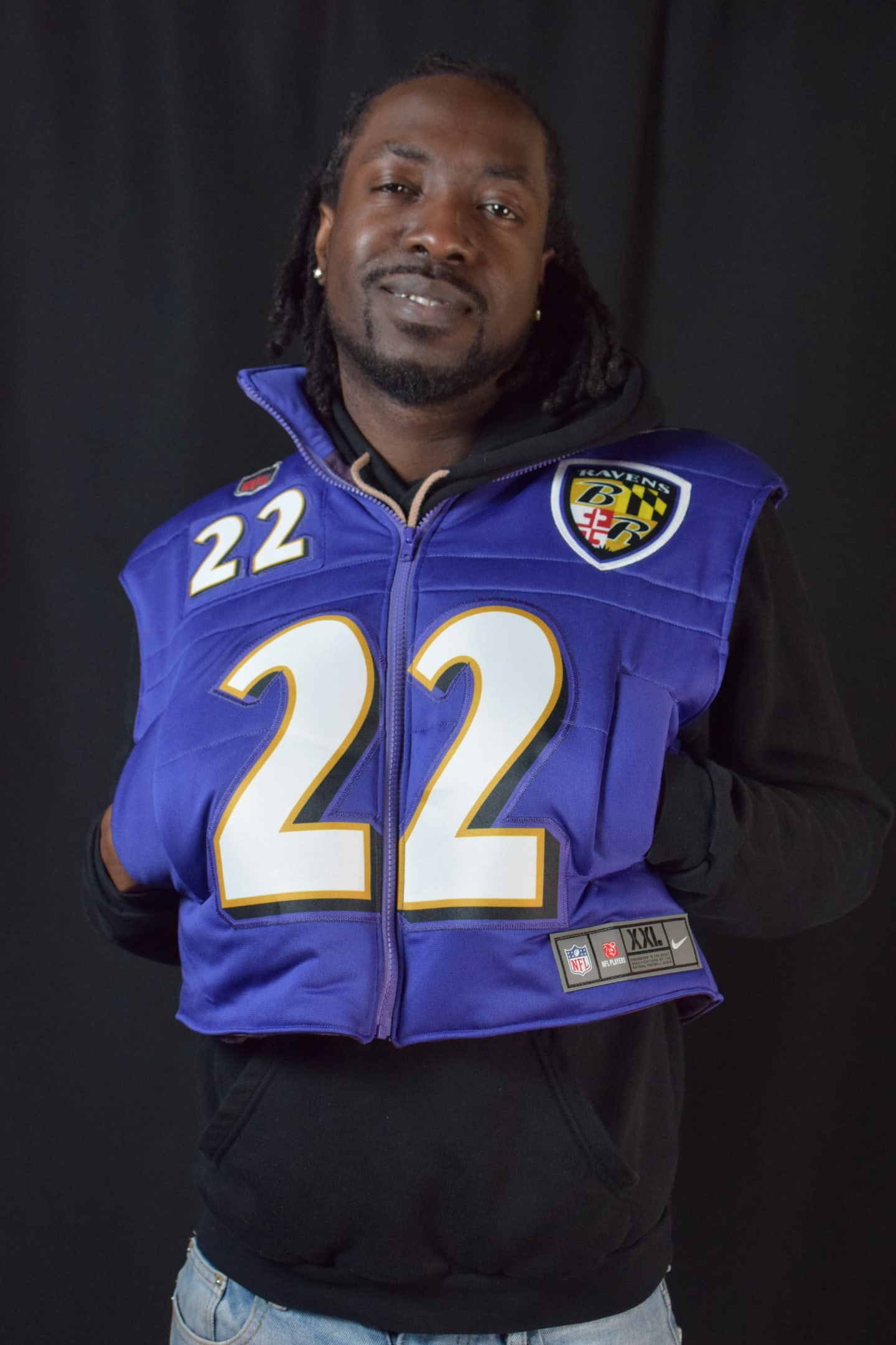 Custom TMADE puffer vest built from a Baltimore Ravens Henry number 22 jersey