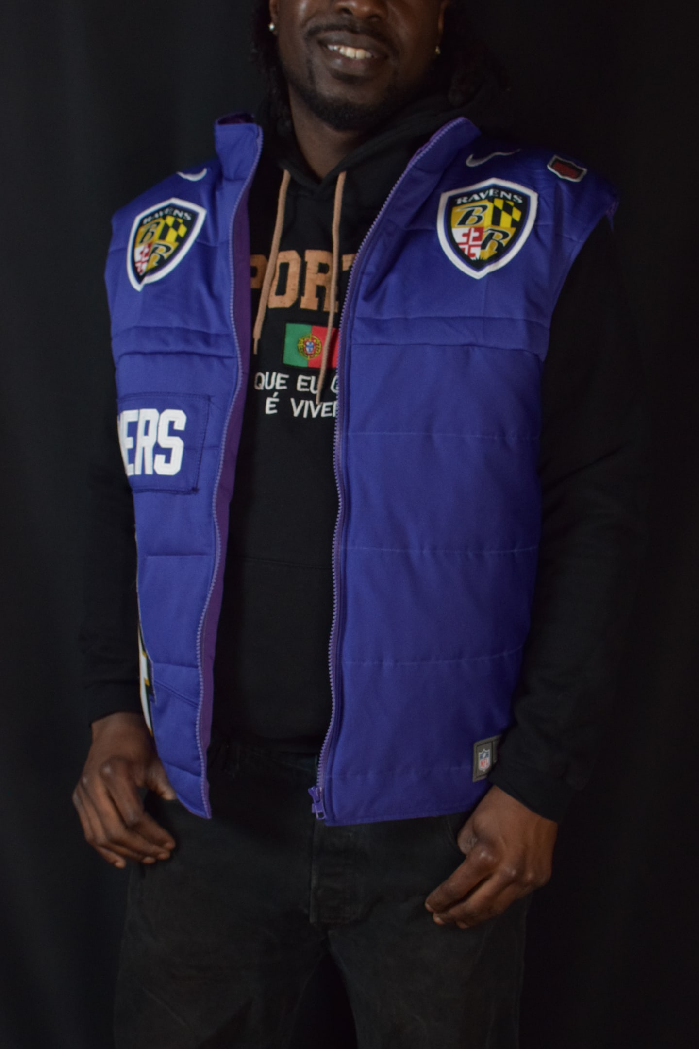 Custom TMADE puffer vest built from a Baltimore Ravens Flowers number 4 jersey