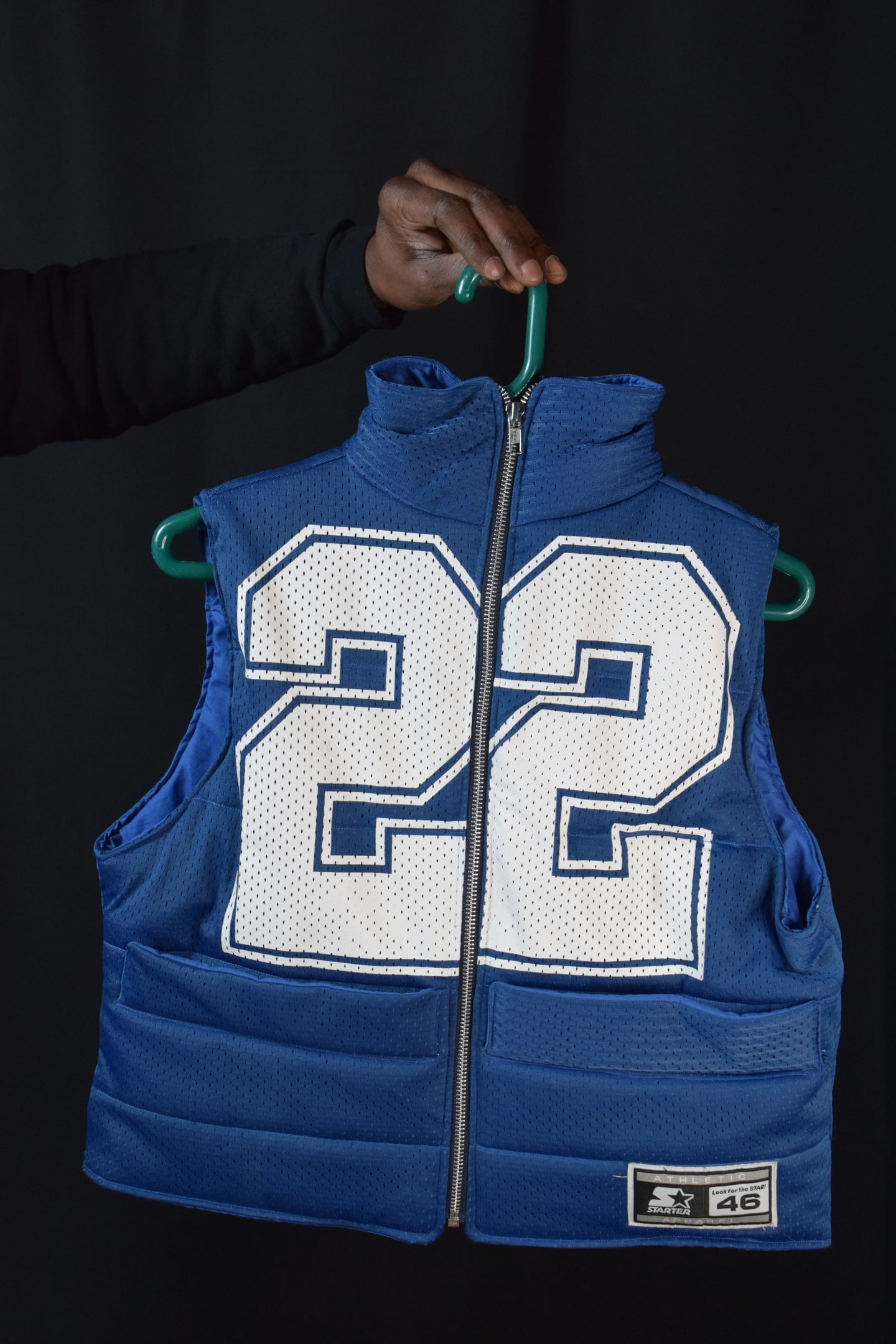 Custom TMADE puffer vest built from a Dallas Cowboys E. Smith number 22 jersey