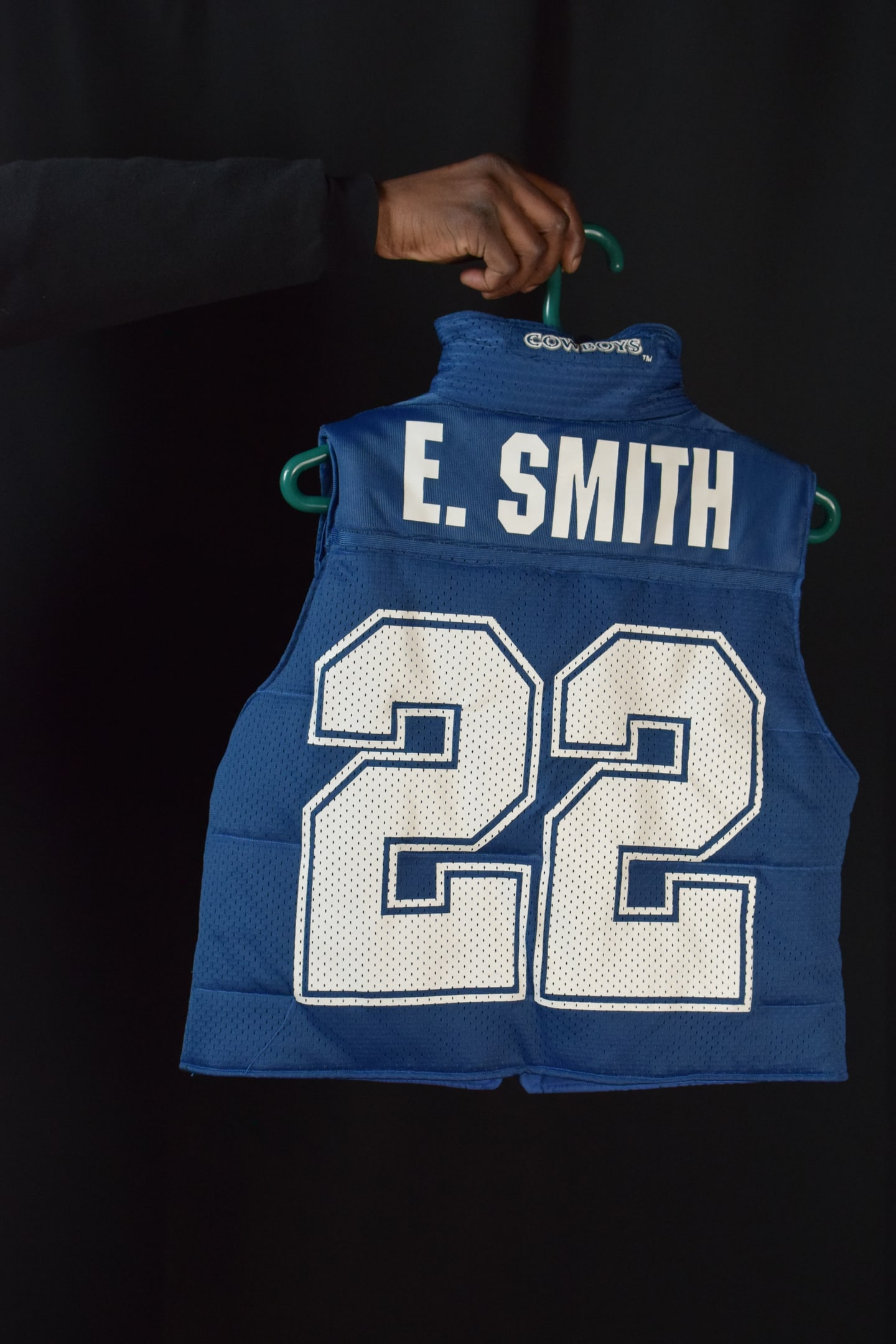 Custom TMADE puffer vest built from a Dallas Cowboys E. Smith number 22 jersey
