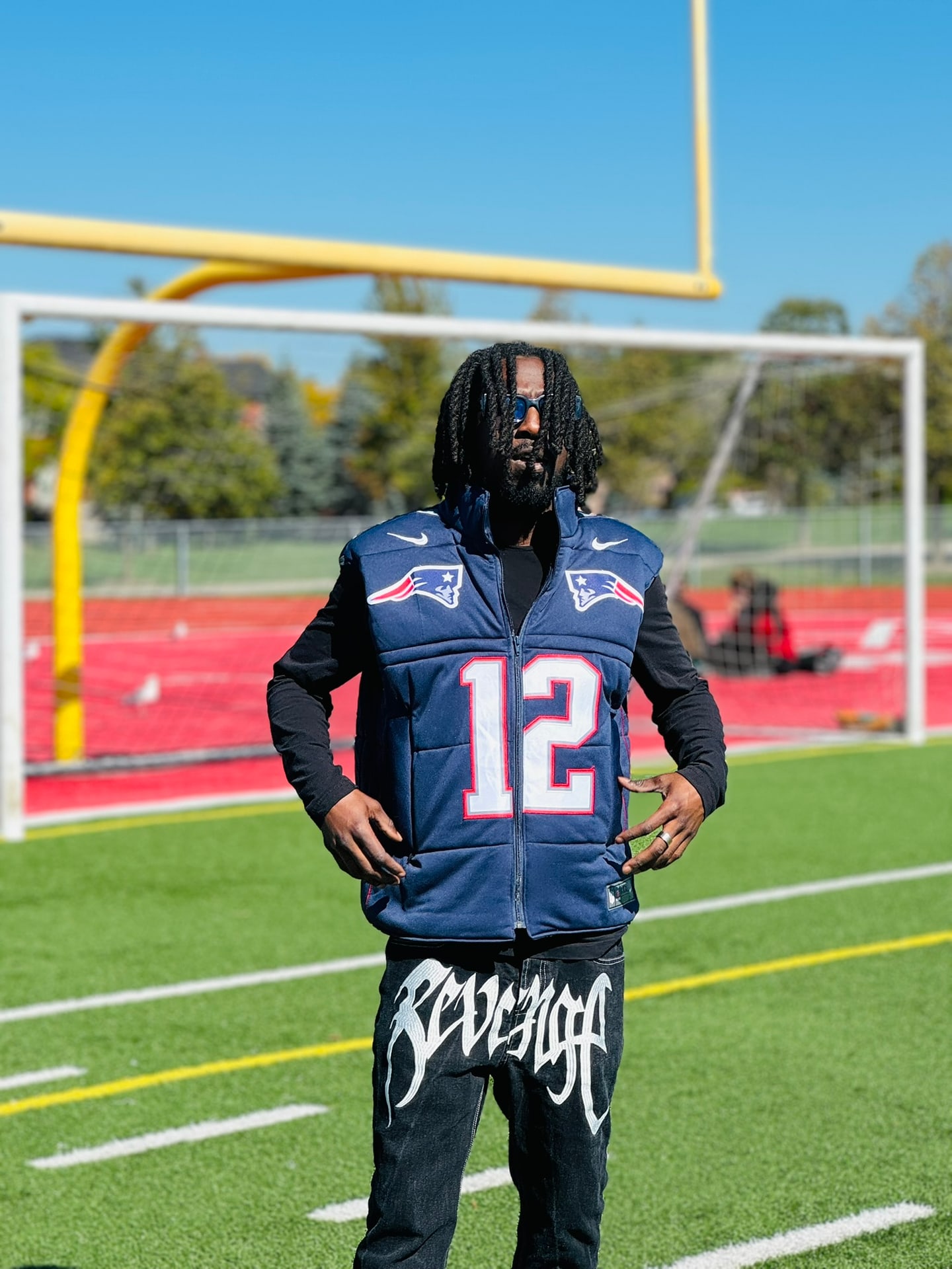 Custom TMADE puffer vest built from a New England Patriots Brady number 12 jersey