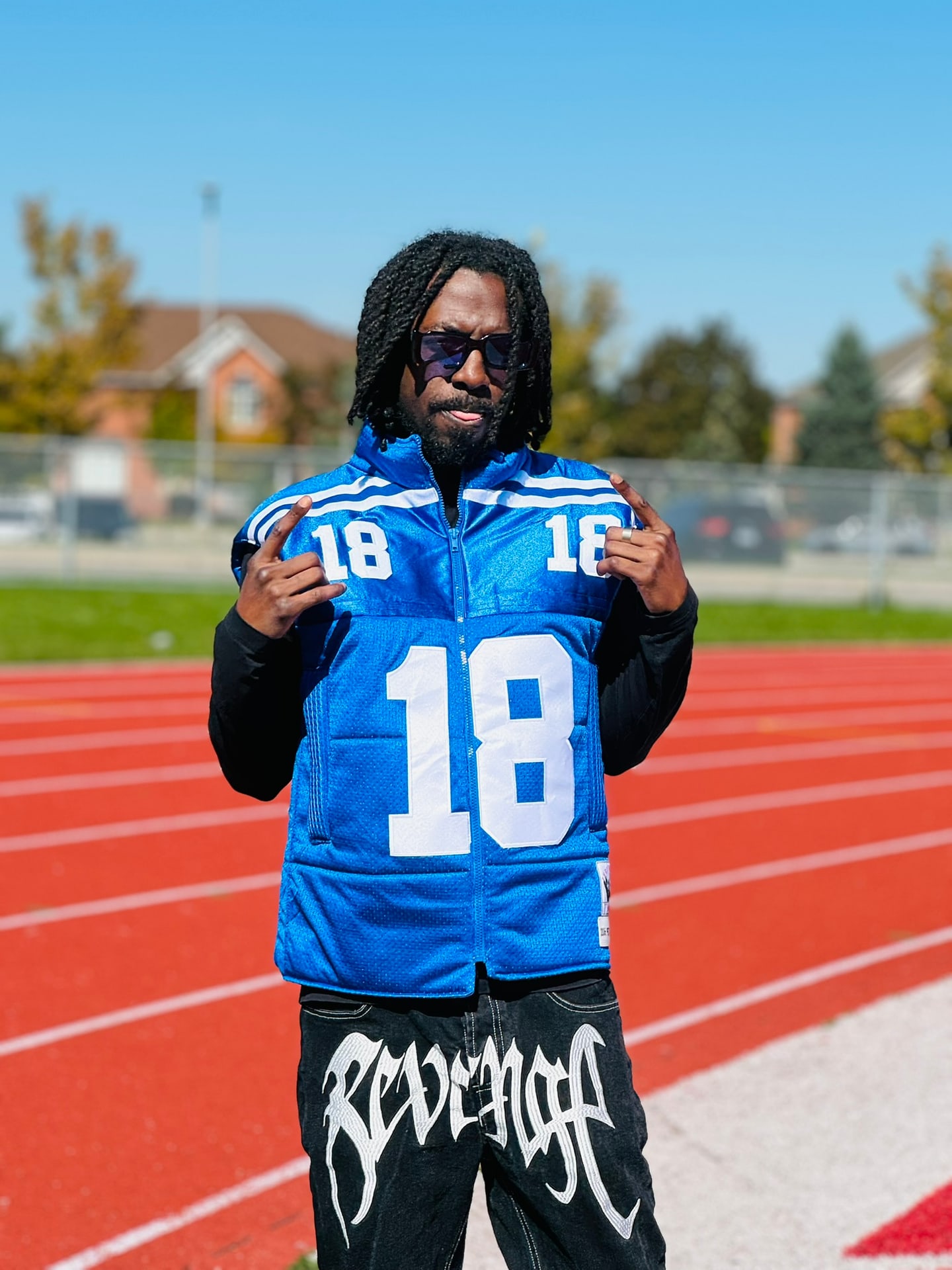 Custom TMADE puffer vest built from a Indianapolis Colts Manning number 18 jersey