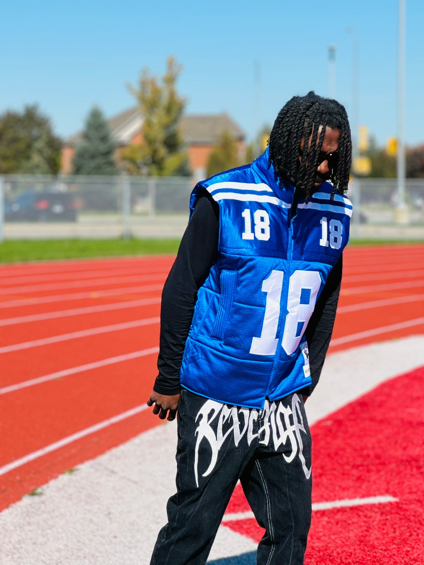 Custom TMADE puffer vest built from a Indianapolis Colts Manning number 18 jersey