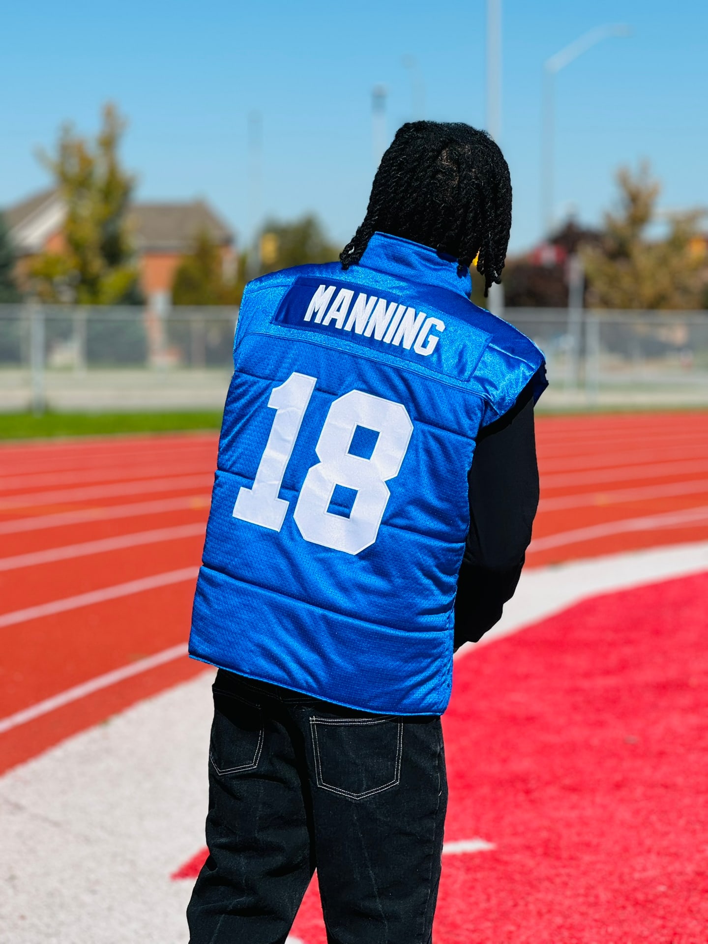 Custom TMADE puffer vest built from a Indianapolis Colts Manning number 18 jersey
