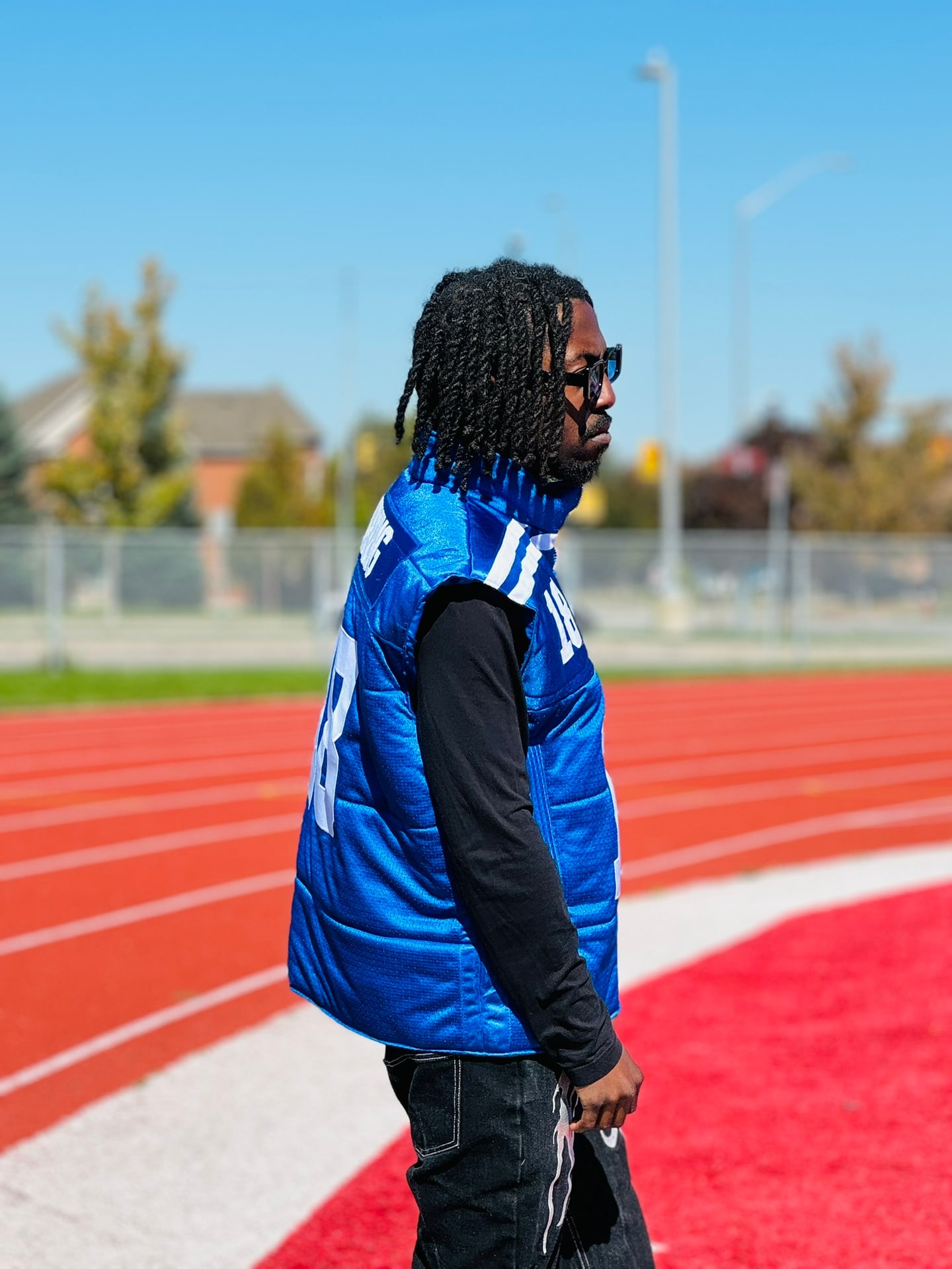 Custom TMADE puffer vest built from a Indianapolis Colts Manning number 18 jersey