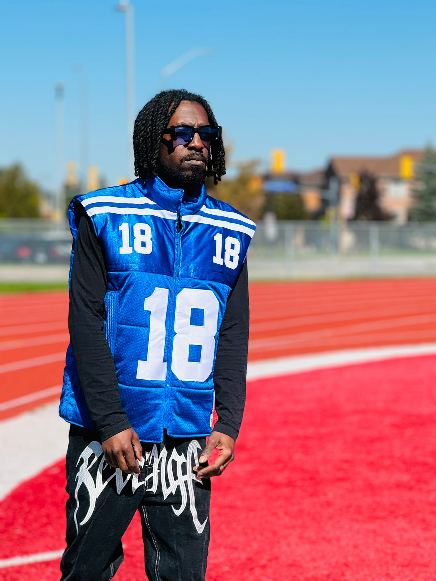 Custom TMADE puffer vest built from a Indianapolis Colts Manning number 18 jersey