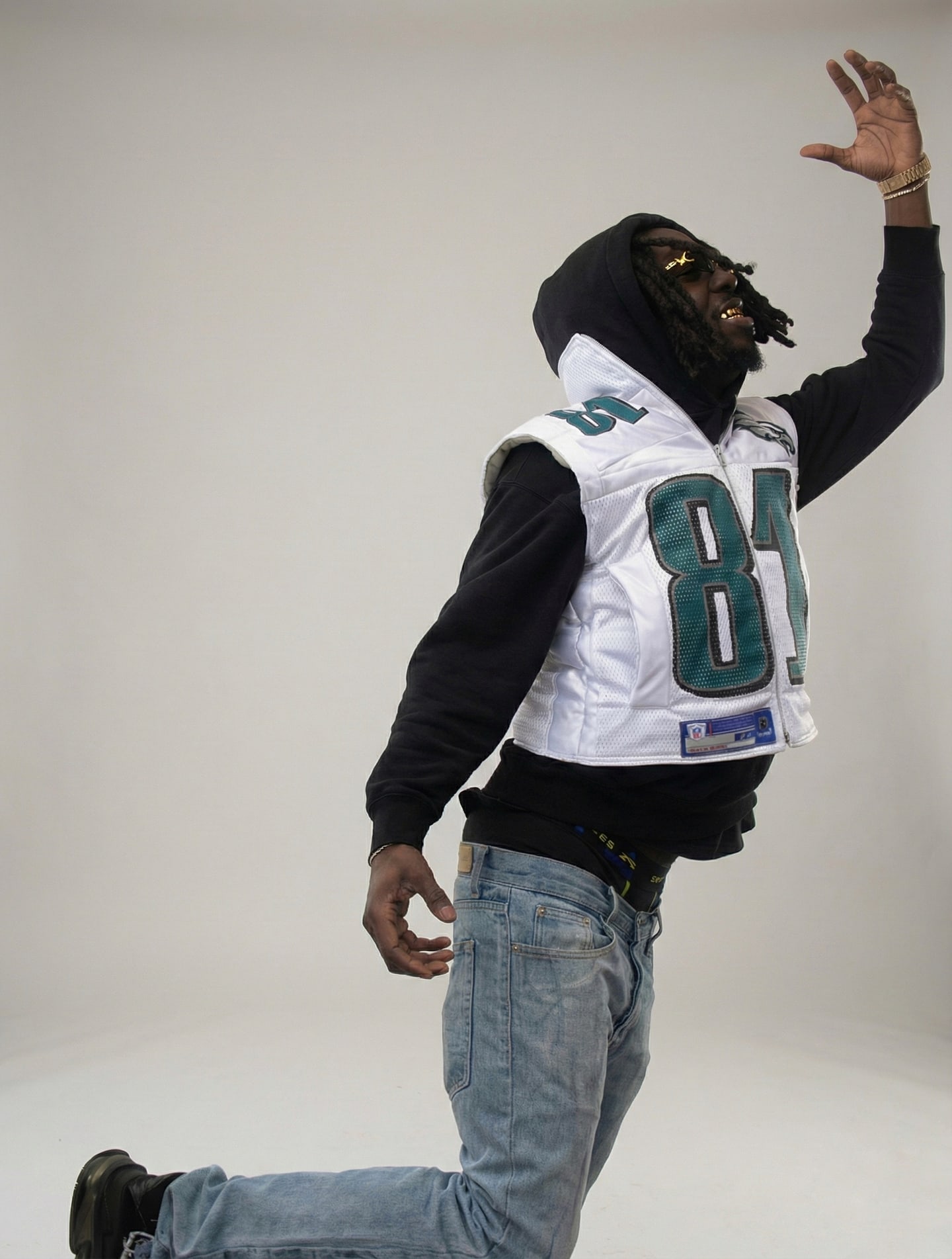 Custom TMADE puffer vest built from a Philadelphia Eagles Owens number 81 jersey