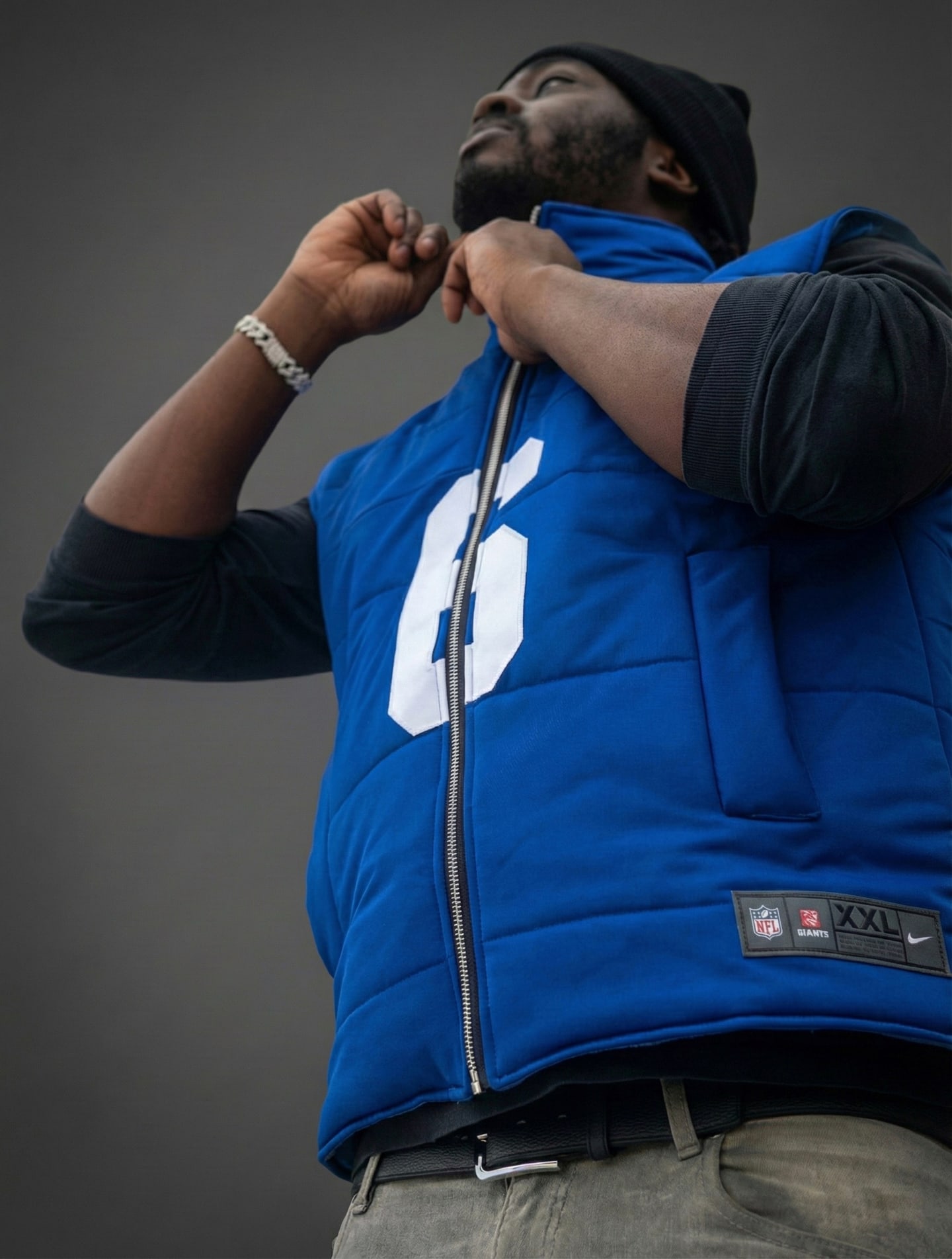 Custom TMADE puffer vest built from a New York Giants Dart number 6 jersey